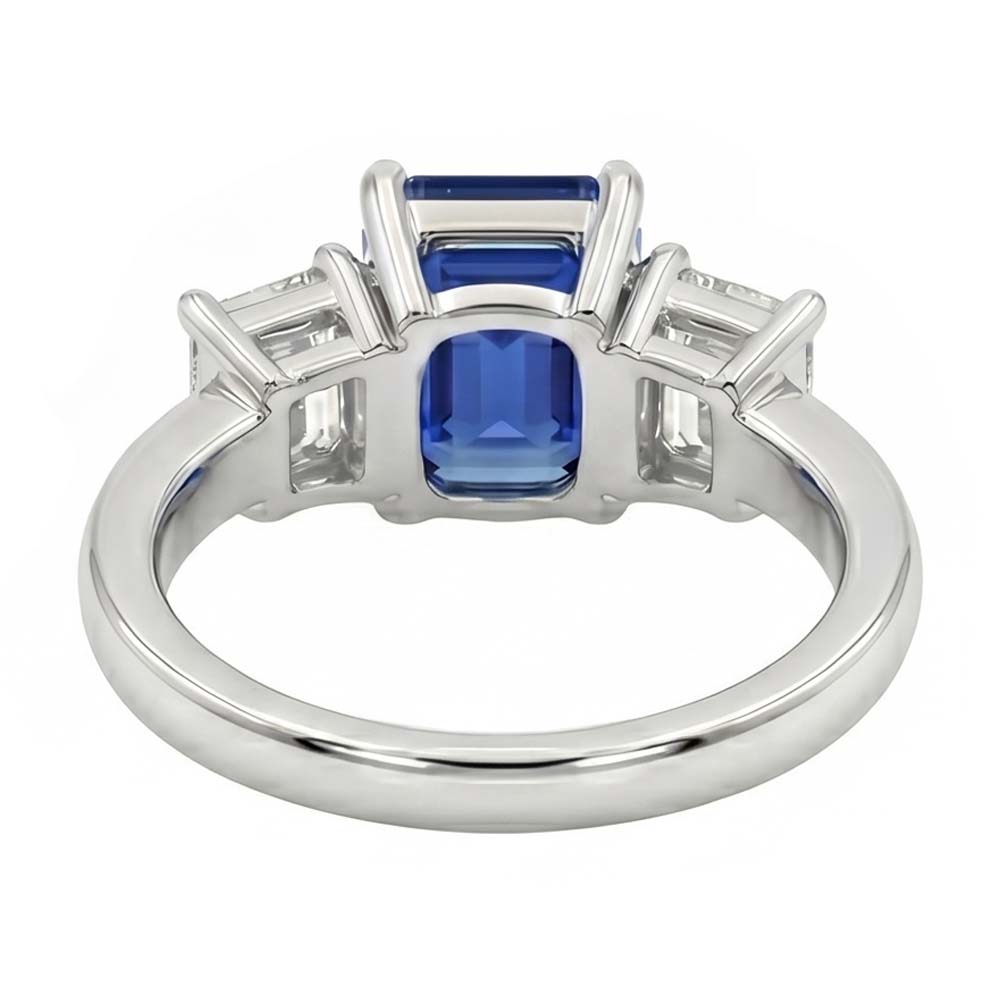 Anello con zaffiro blu smeraldo da 2,50 carati e diamanti tre pietre