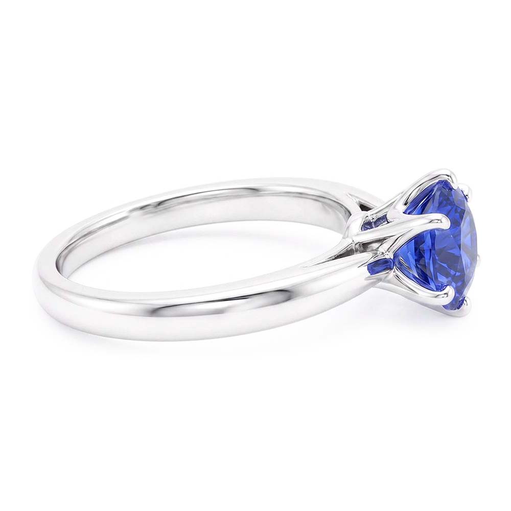 Anello da donna in oro con solitario zaffiro blu 1.50 carati con gambo pizzicato