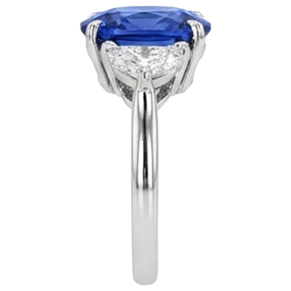 Anello di fidanzamento con tre pietre di diamanti e zaffiro blu. oro 8 carati 14K