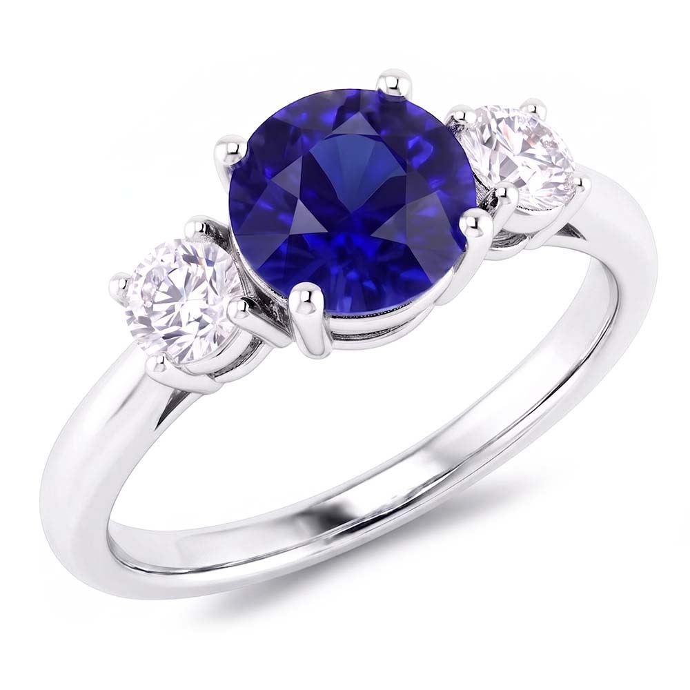 Anello di fidanzamento con tre pietre. zaffiro blu rotondo. 2.50 carati. diamanti