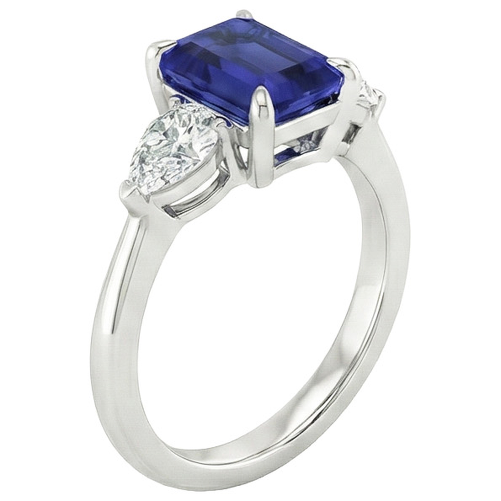Anello in oro 3 pietre con zaffiro blu taglio smeraldo e diamante a pera 3.50 carati