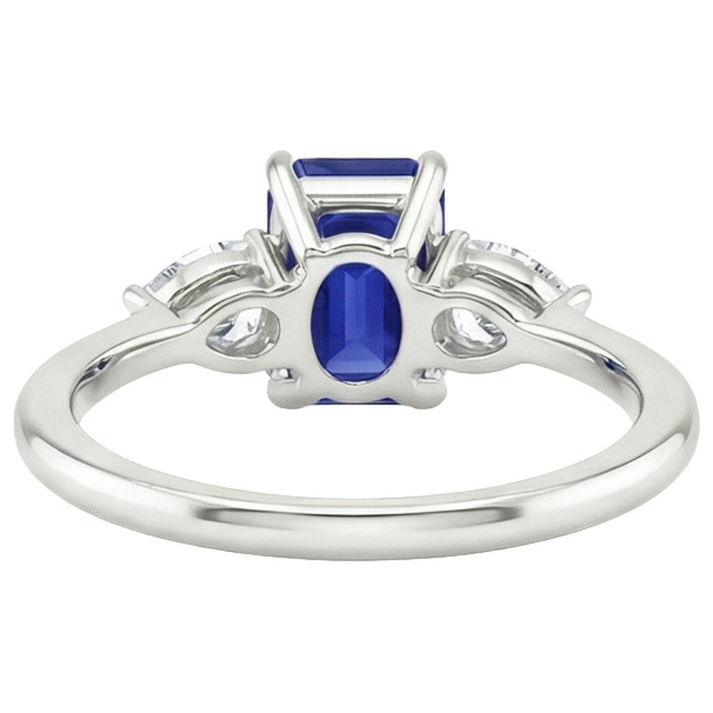 Anello in oro 3 pietre con zaffiro blu taglio smeraldo e diamante a pera 3.50 carati