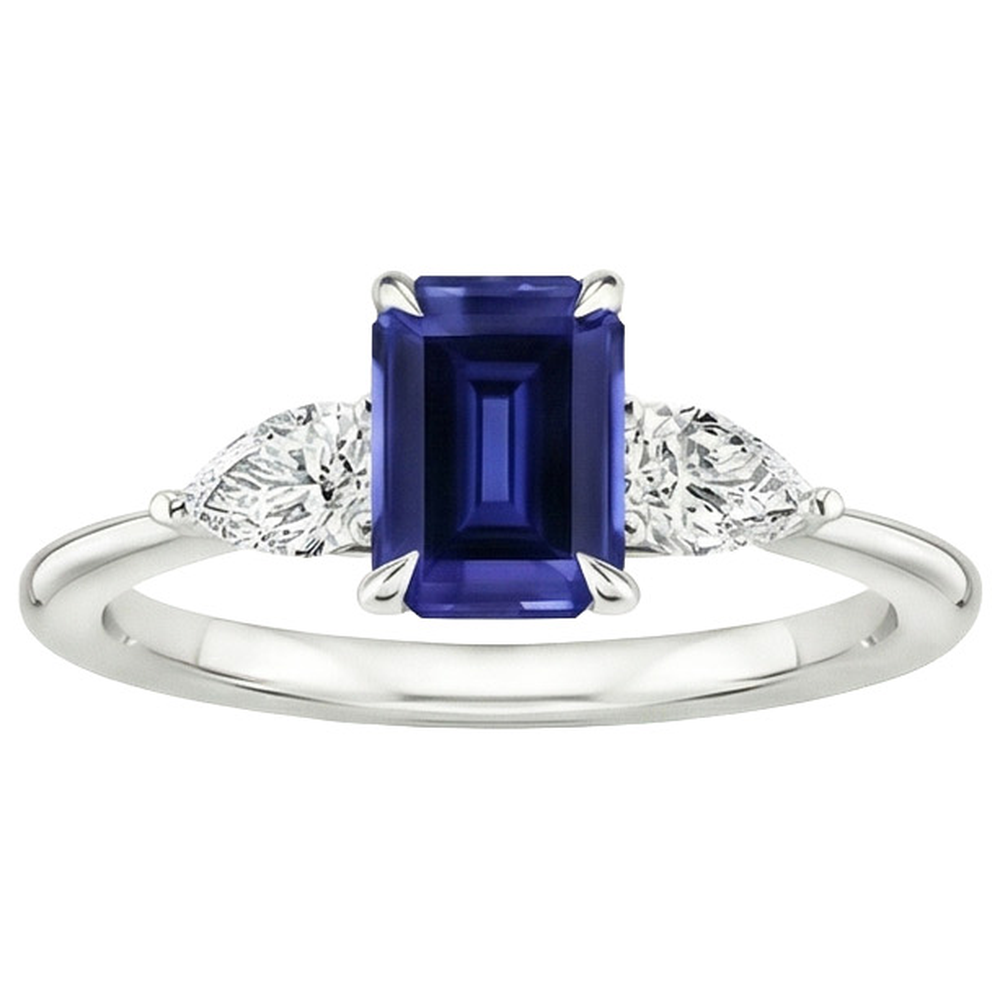 Anello in oro 3 pietre con zaffiro blu taglio smeraldo e diamante a pera 3.50 carati