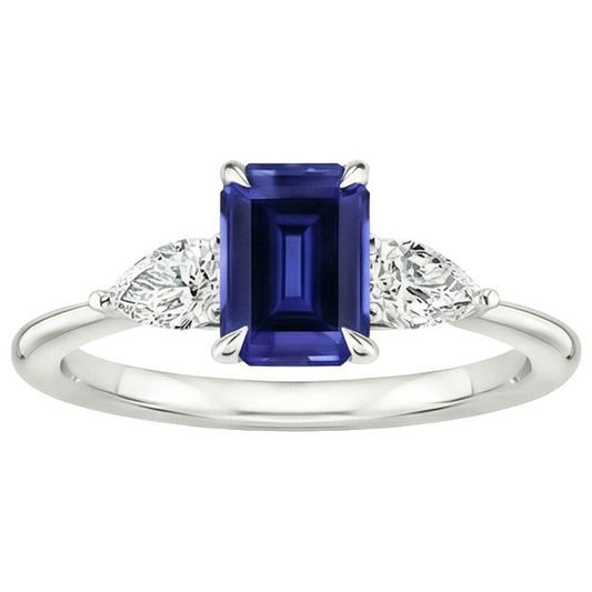 Anello in oro 3 pietre con zaffiro blu taglio smeraldo e diamante a pera 3.50 carati
