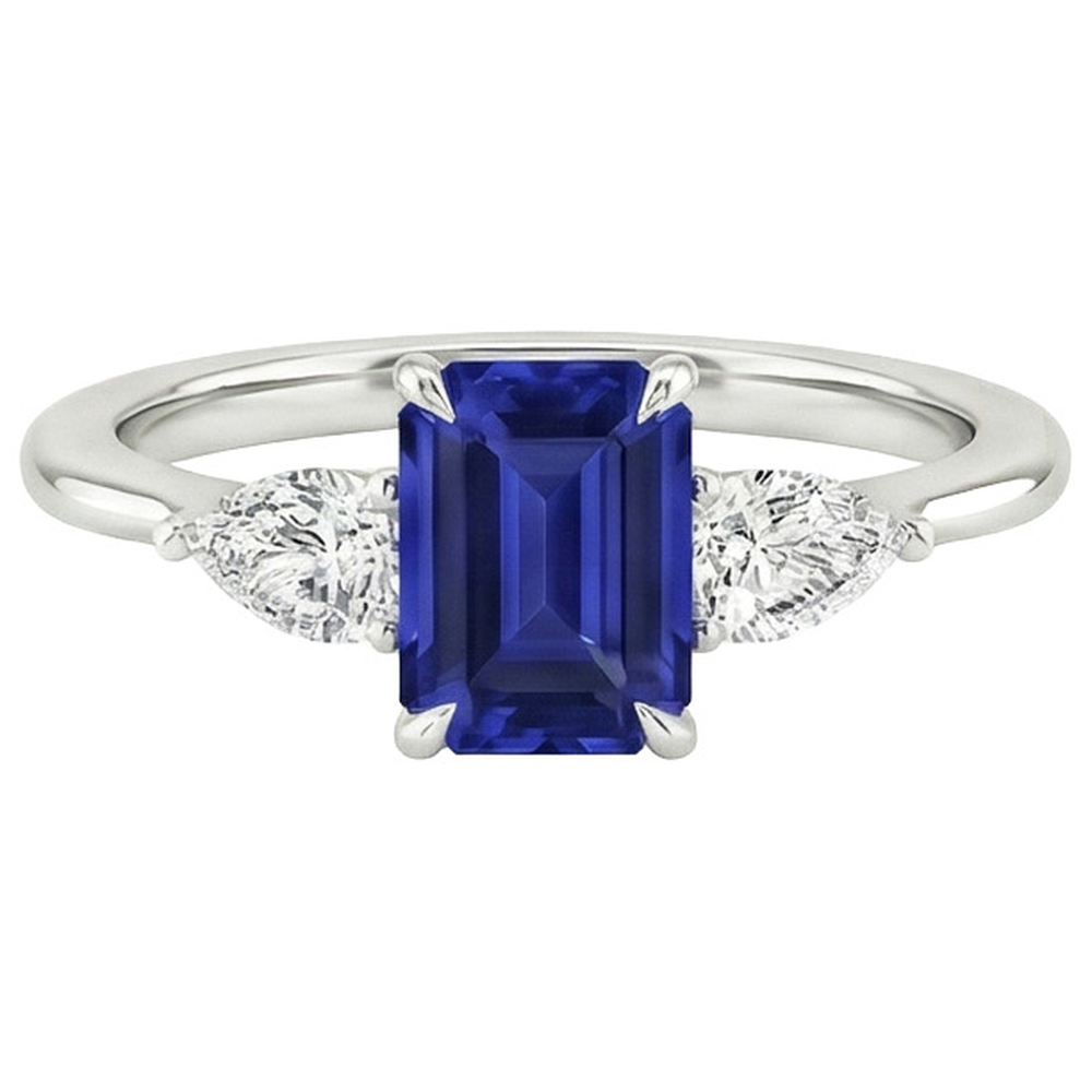Anello in oro 3 pietre con zaffiro blu taglio smeraldo e diamante a pera 3.50 carati