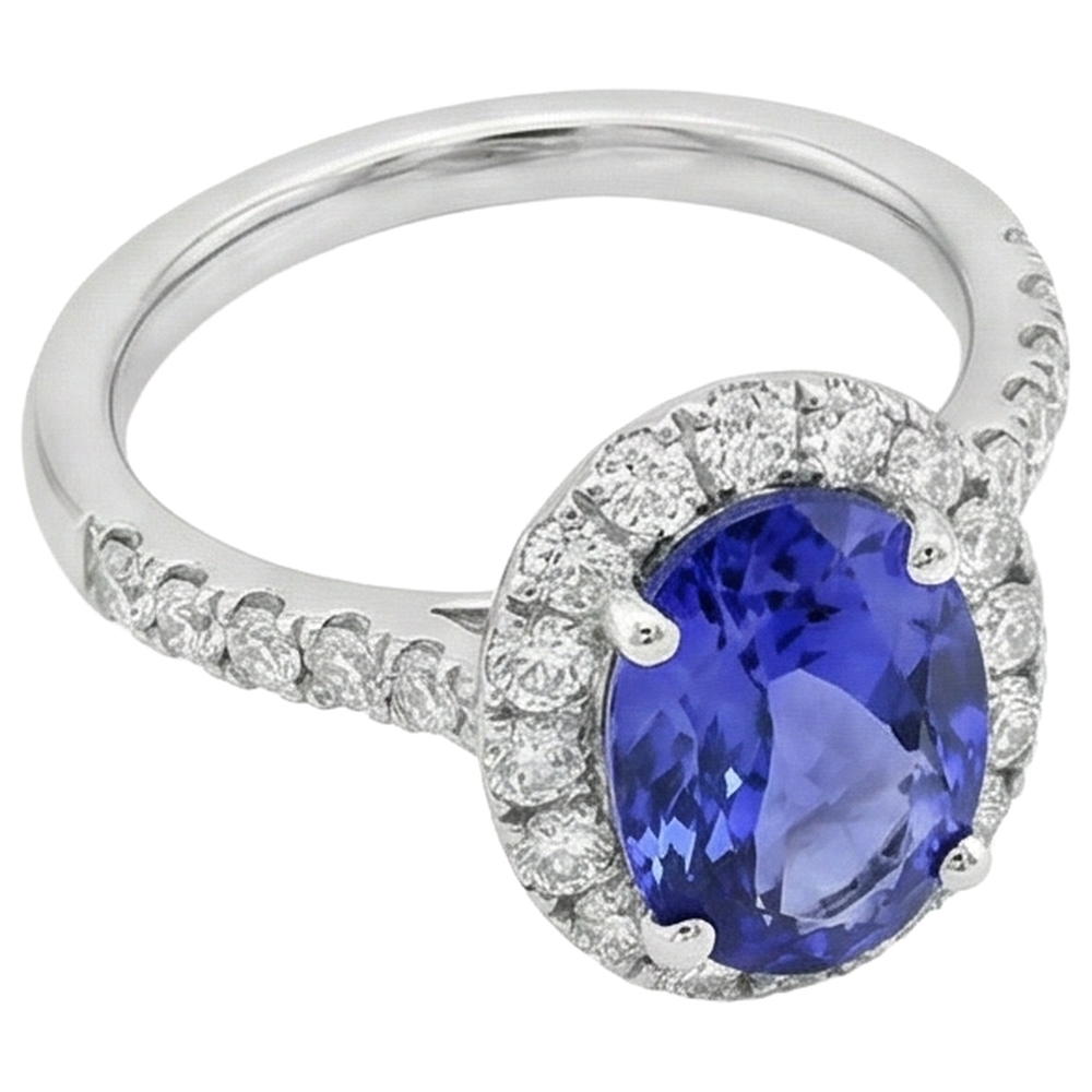 Anello in oro bianco 14 carati con tanzanite ovale da 11.25 carati con diamanti rotondi