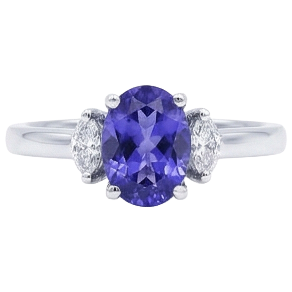 Anello in oro bianco 14 kt con tre pietre di tanzanite e diamanti da 3.50 carati