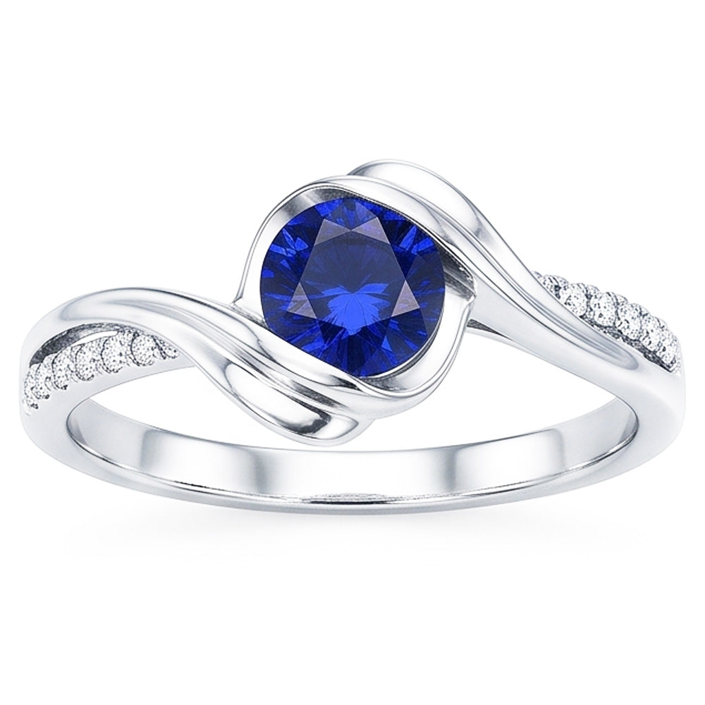 Anello in oro bianco 14K e diamanti con zaffiro tondo. 1,50 carati. stelo intrecciato