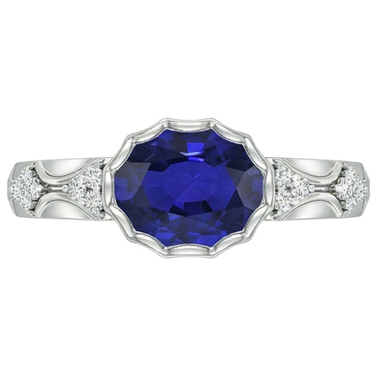 Anello in oro bianco con diamanti da donna. lunetta con zaffiro blu ovale. 3.75 carati