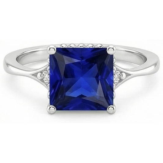 Anello in oro con 3 pietre. diamanti e zaffiro blu. gambo diviso 5.25 carati