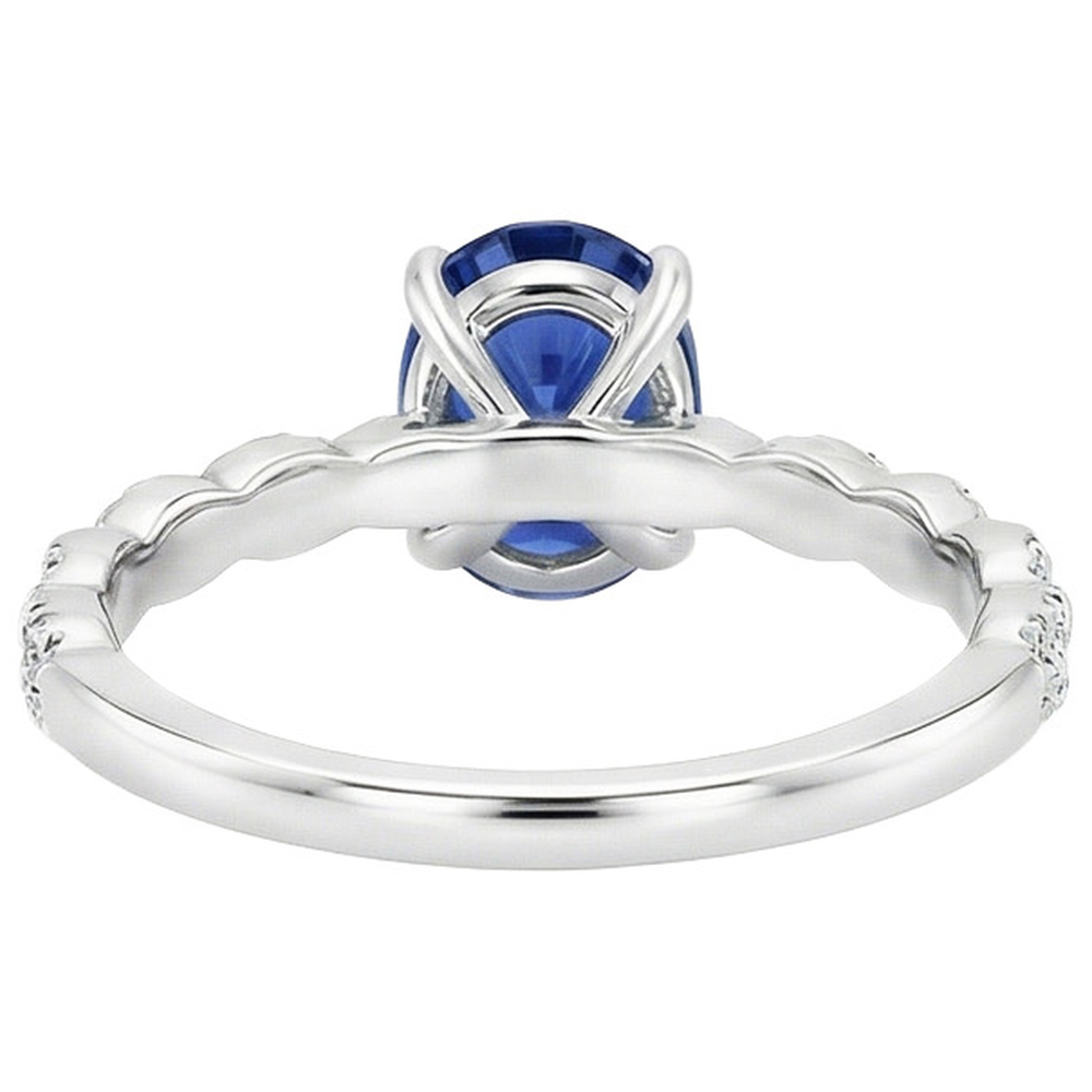 Anello in oro con pietre preziose. zaffiro blu ovale e pavé di diamanti 3.50 carati