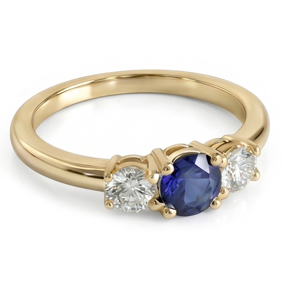 Anello in oro giallo 14 carati con 3 pietre. zaffiro blu rotondo e diamanti da 1,50 carati