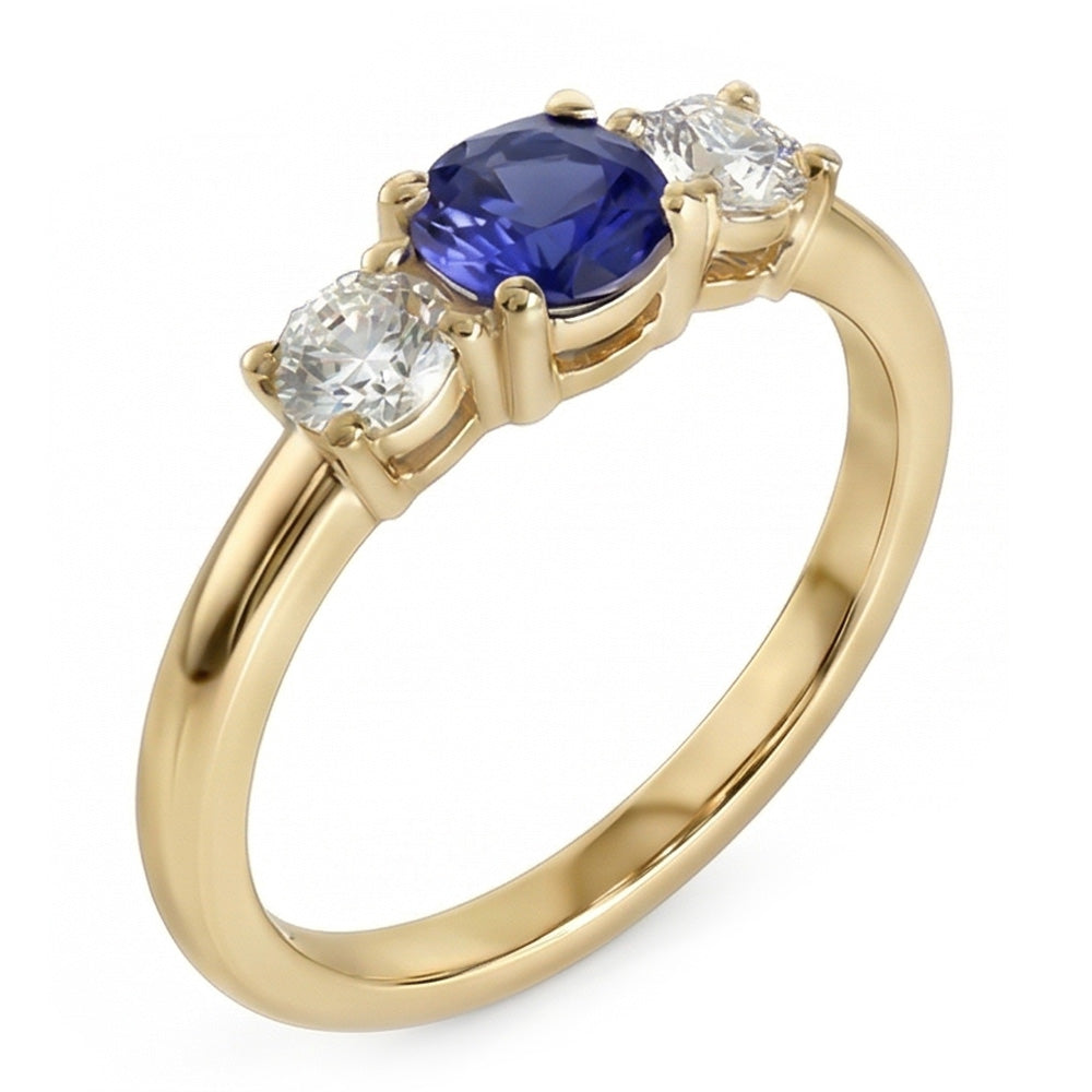 Anello in oro giallo 14 carati con 3 pietre. zaffiro blu rotondo e diamanti da 1,50 carati