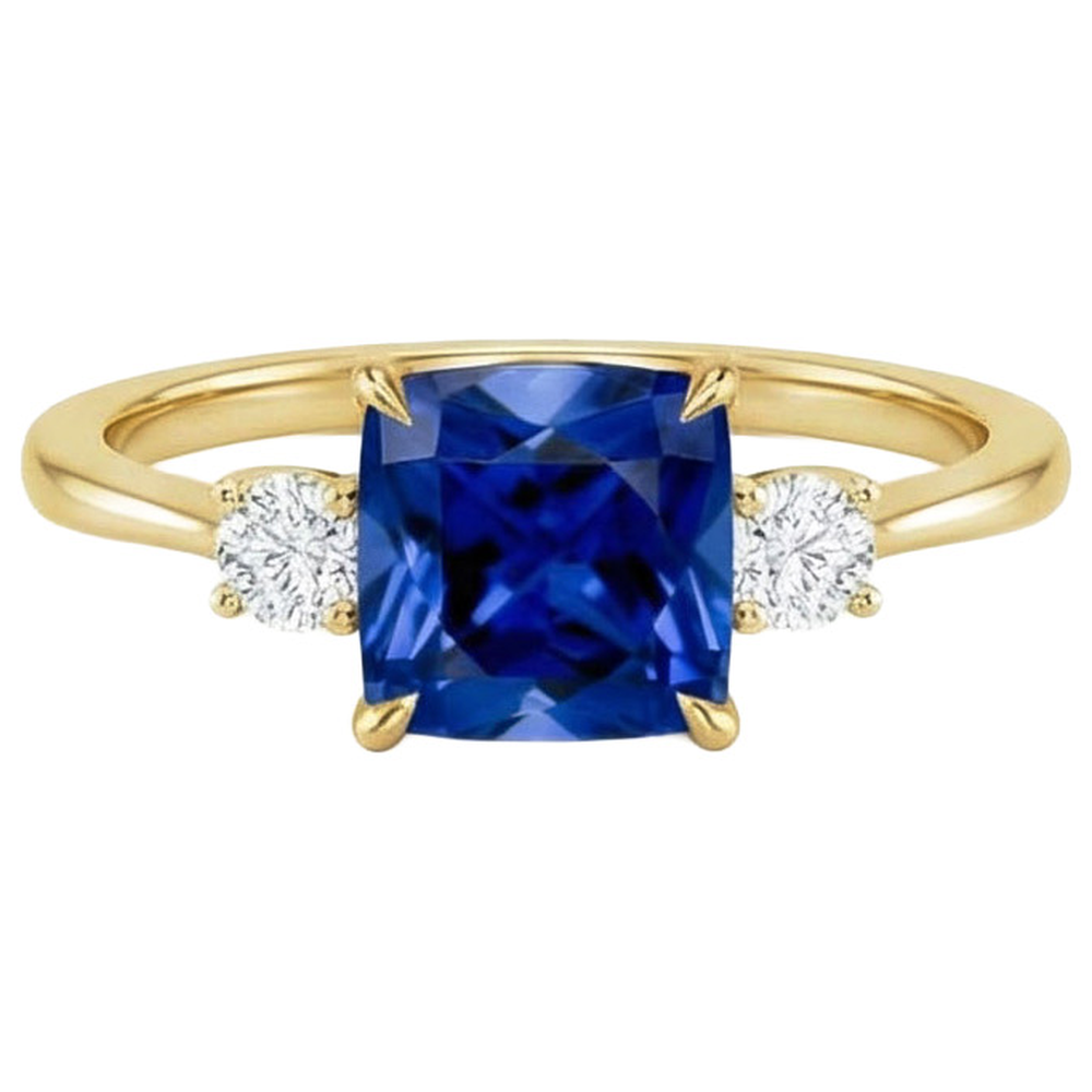 Anello in oro giallo con 3 pietre. diamante e cuscino. zaffiro blu 2.50 carati