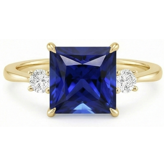 Anello in oro giallo con 3 pietre. zaffiro blu principessa e diamanti 5.25 carati