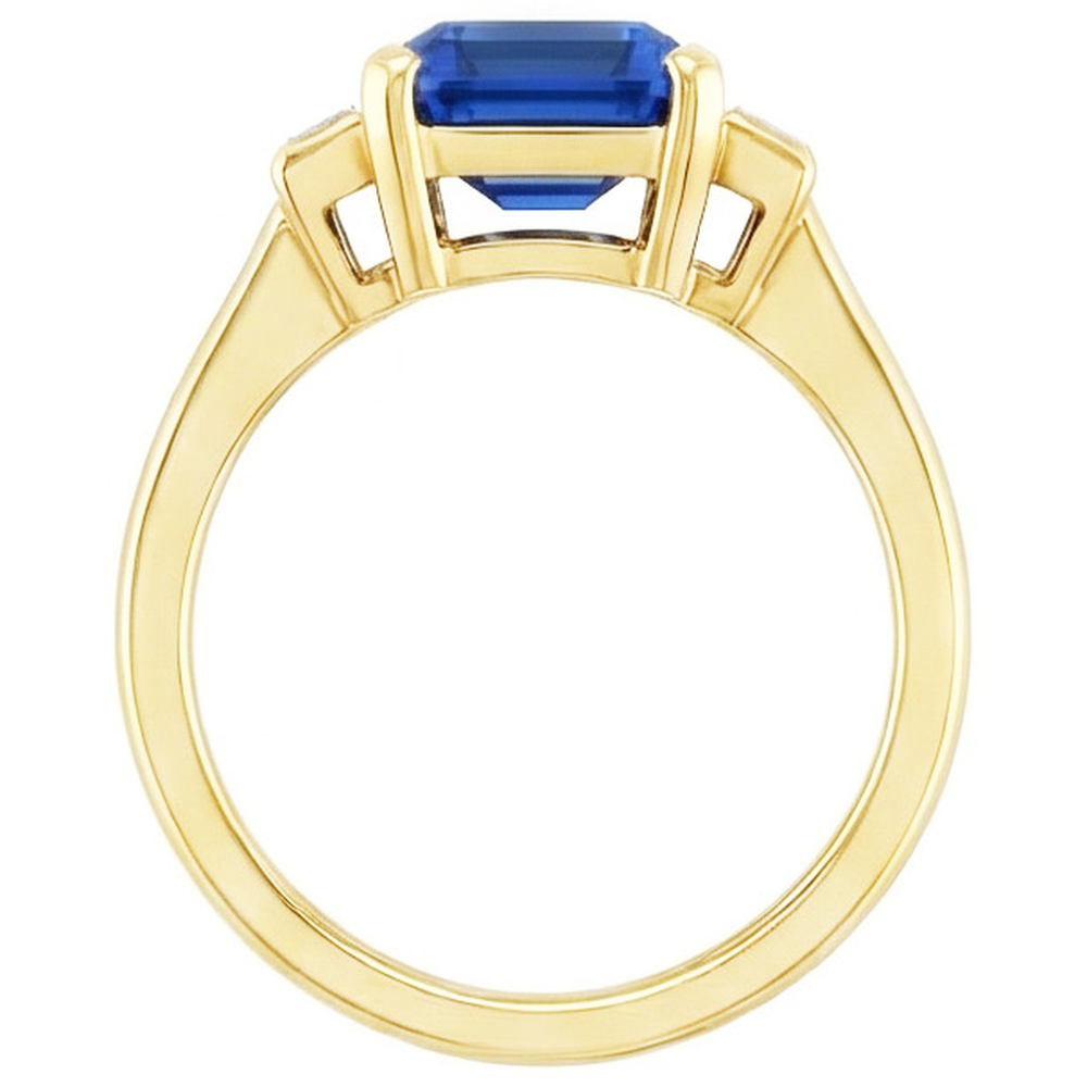 Anello in oro giallo con pietre preziose e smeraldo. diamanti baguette. 5 carati. 3 pietre