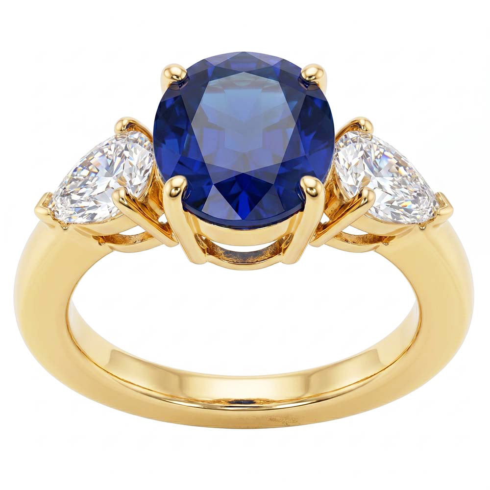 Anello in oro giallo con zaffiro blu ovale e diamante a pera 3 pietre 5.25 carati