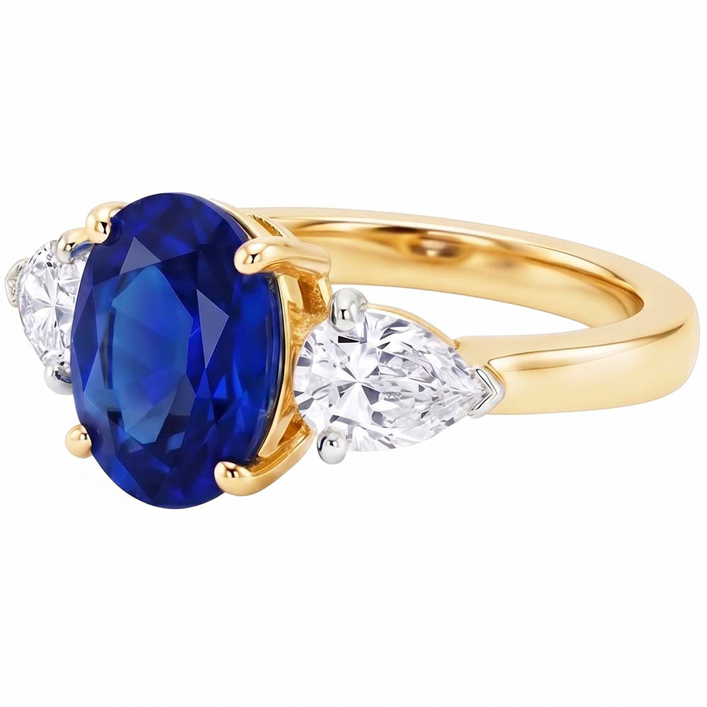 Anello in oro giallo con zaffiro blu ovale e diamante a pera 3 pietre 5.25 carati