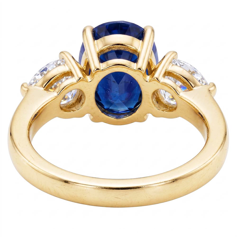 Anello in oro giallo con zaffiro blu ovale e diamante a pera 3 pietre 5.25 carati
