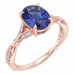 Anello in oro rosa con pietre preziose con gambo diviso. zaffiro blu e diamanti 3 carati