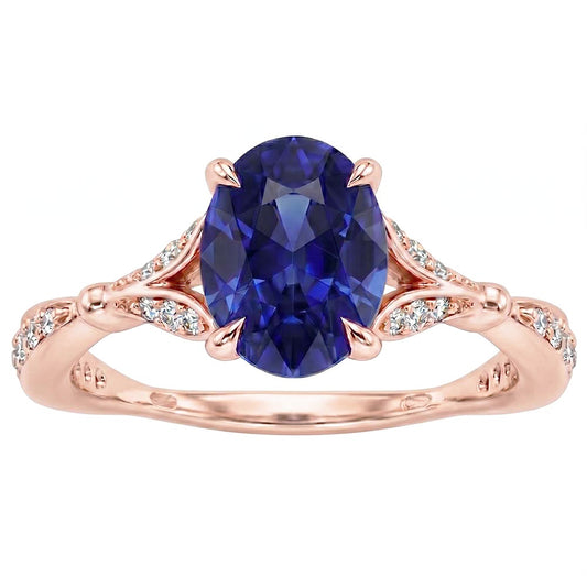 Anello in oro rosa con pietre preziose con gambo diviso. zaffiro blu e diamanti 3 carati