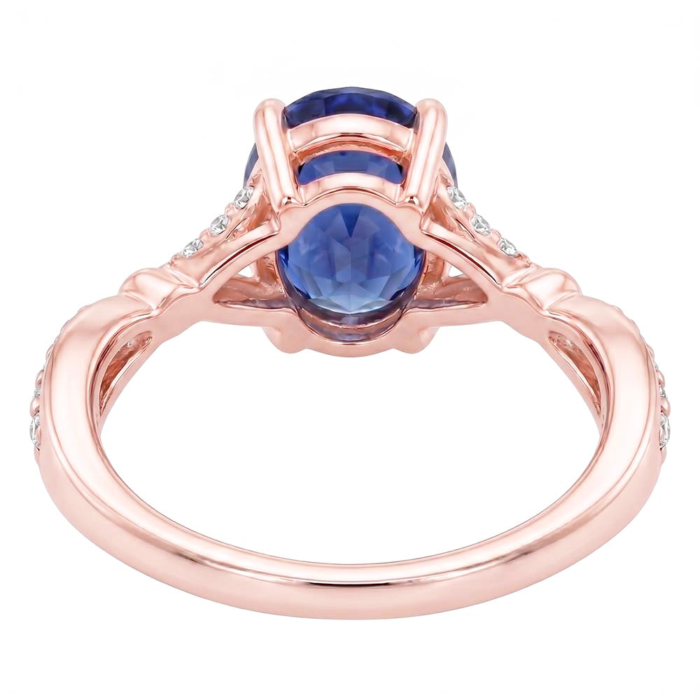 Anello in oro rosa con pietre preziose con gambo diviso. zaffiro blu e diamanti 3 carati