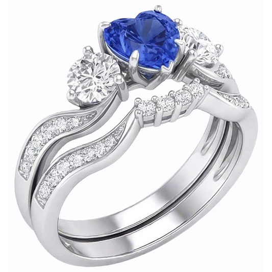 Anello nuziale con 3 pietre incastonato con zaffiro blu a cuore e diamanti rotondi 3 carati