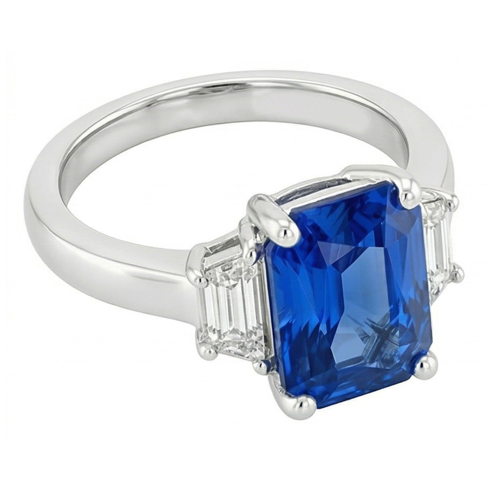 Anello nuziale con 3 pietre. zaffiro radiante e diamanti smeraldo. 1.75 carati