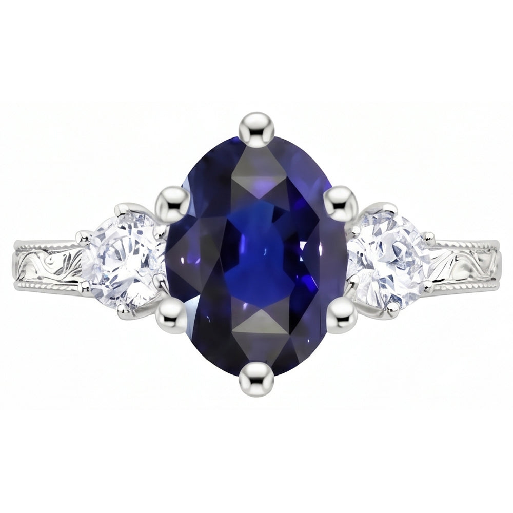 Anello old style con zaffiro blu 2,50 carati e diamanti 3 pietre in oro bianco 14K