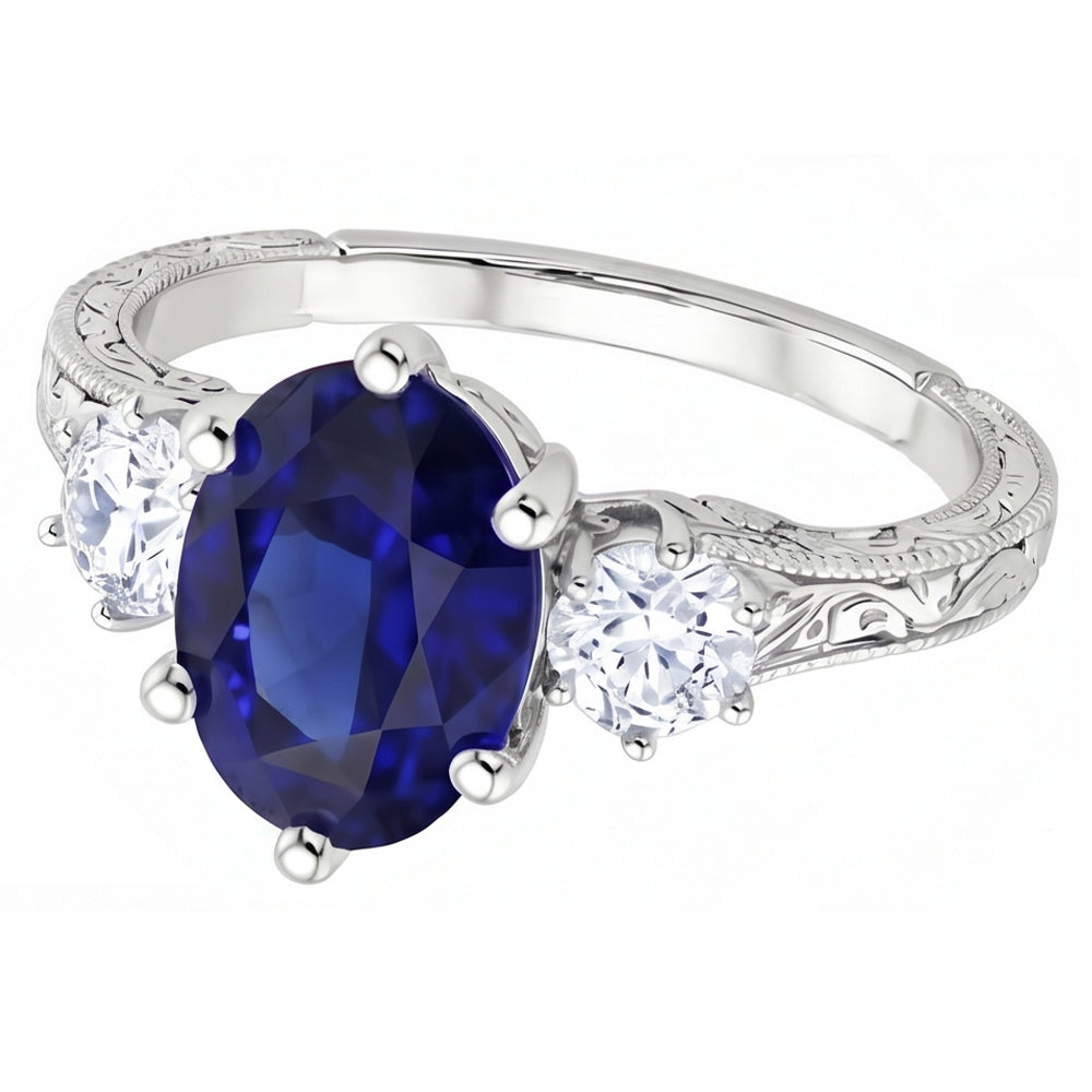 Anello old style con zaffiro blu 2,50 carati e diamanti 3 pietre in oro bianco 14K