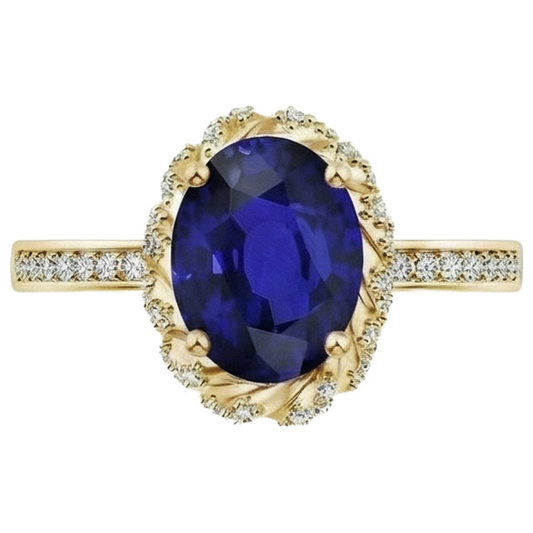 Anello ovale con gemma aureola blu zaffiro pavé di diamanti oro giallo 7 carati