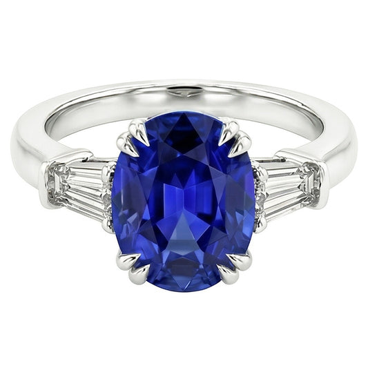 Anello ovale con tre pietre di zaffiro blu con diamante baguette 3.25 carati
