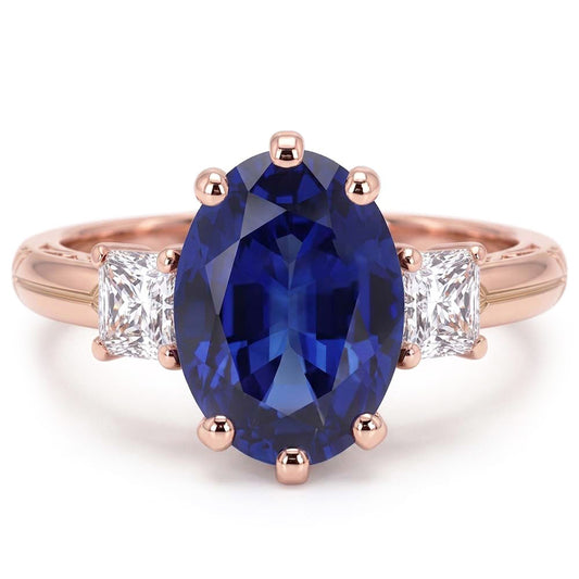 Anello ovale con tre pietre di zaffiro blu e diamanti 2.50 carati