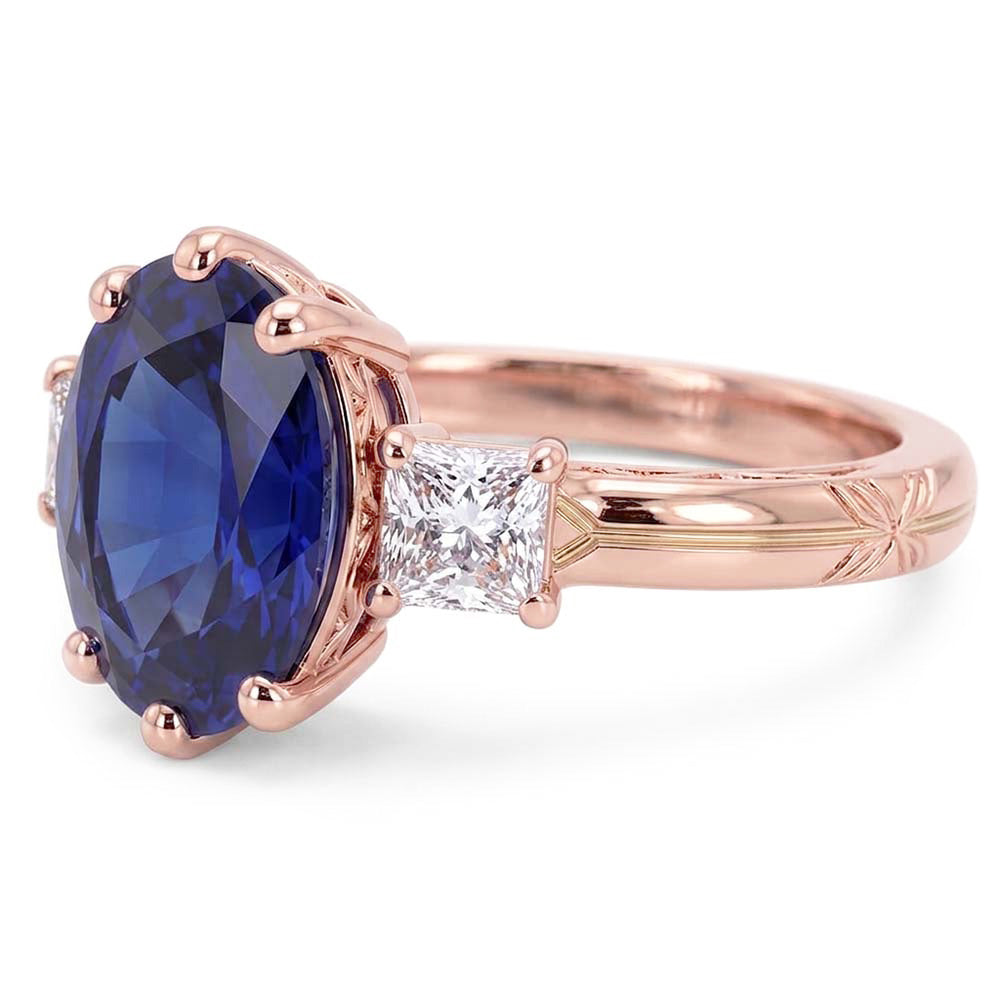 Anello ovale con tre pietre di zaffiro blu e diamanti 2.50 carati