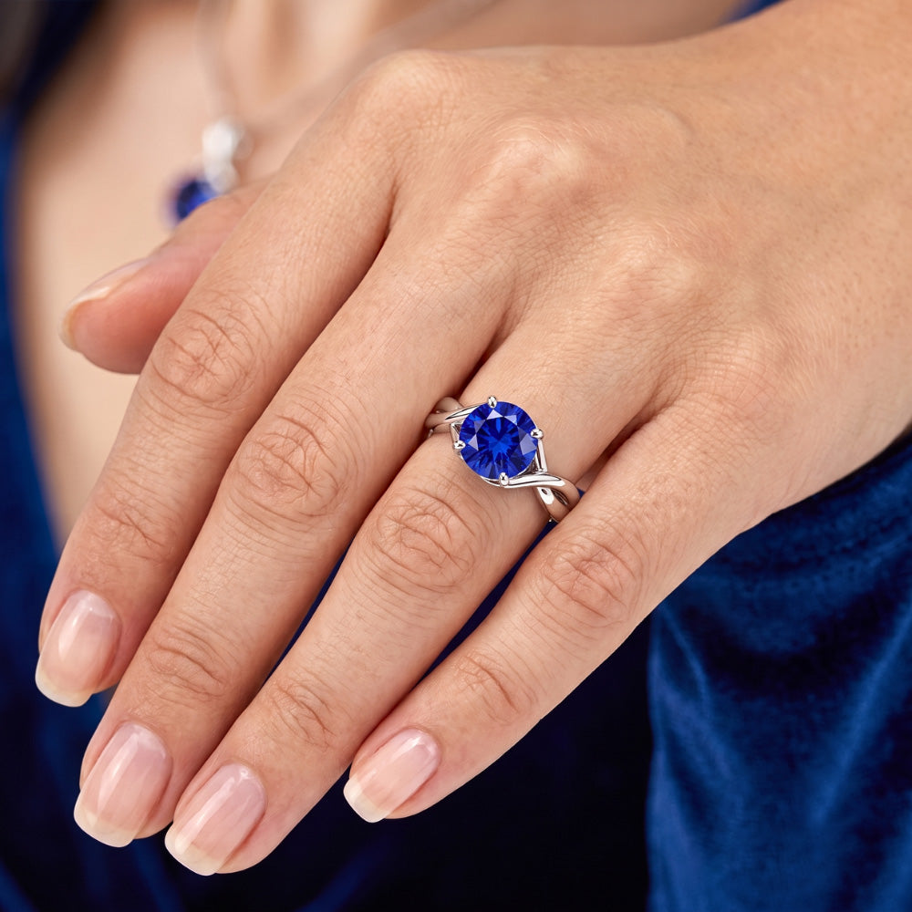 Anello solitario con gemma blu zaffiro 2 carati con gambo intrecciato