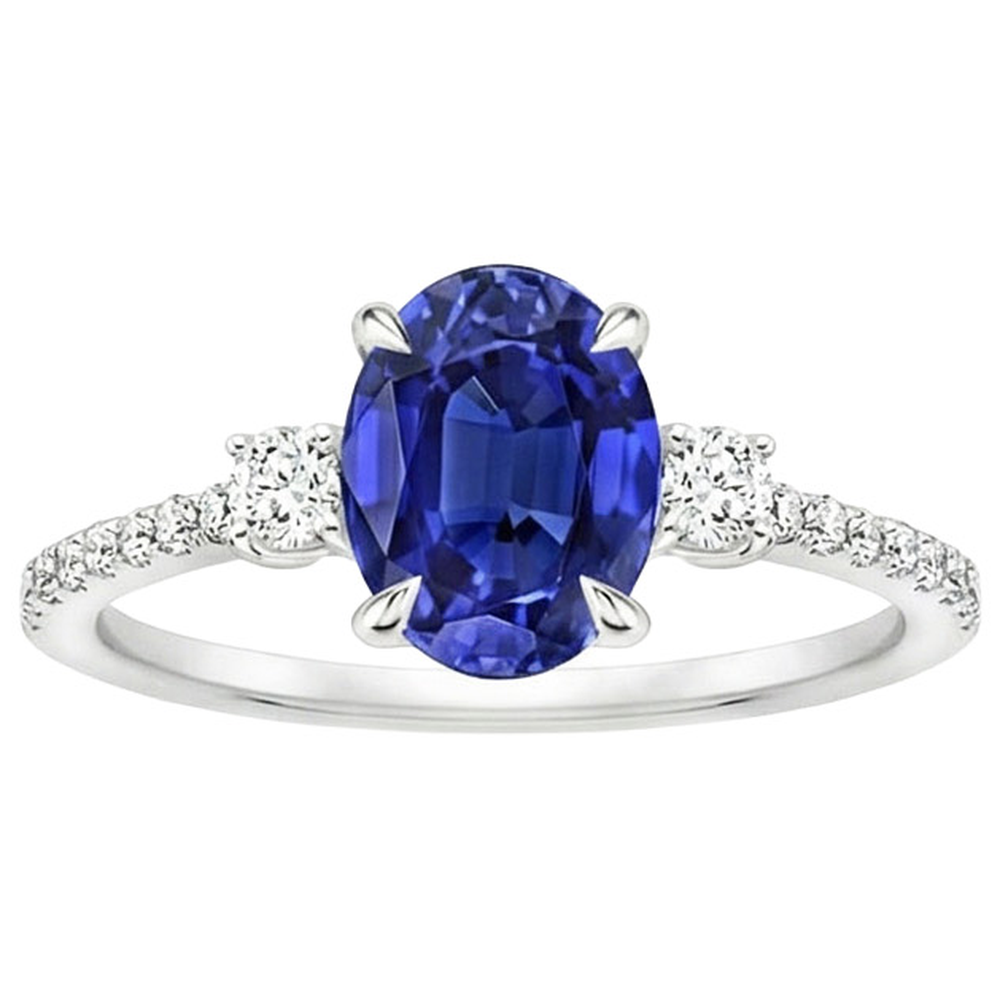 Anello solitario con zaffiro blu 3,50 carati e diamanti tondi in oro bianco 14K