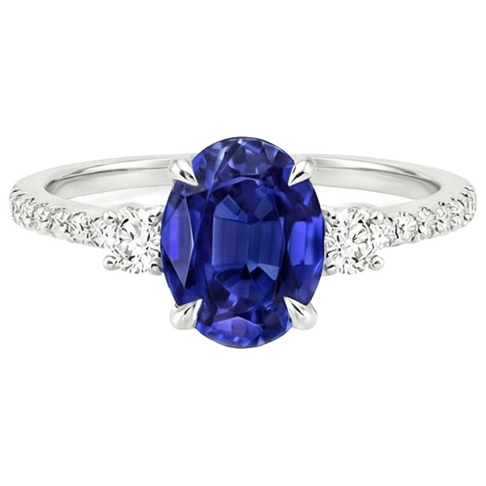 Anello solitario con zaffiro blu 3,50 carati e diamanti tondi in oro bianco 14K