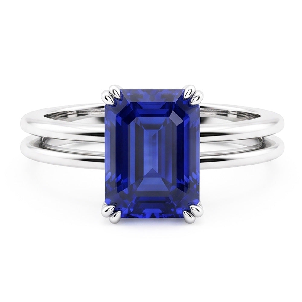Anello solitario con zaffiro blu smeraldo a doppia punta con gambo diviso 2 carati