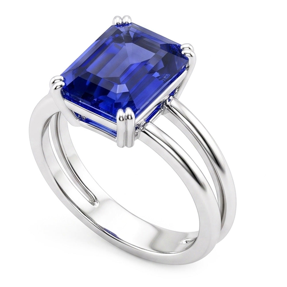 Anello solitario con zaffiro blu smeraldo a doppia punta con gambo diviso 2 carati