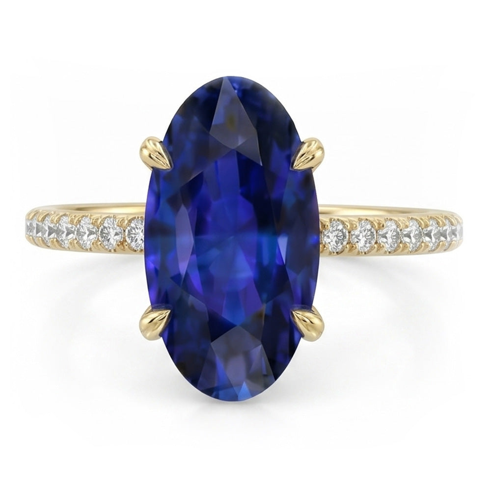 Anello solitario in oro giallo con zaffiro blu ovale con accenti 4 carati
