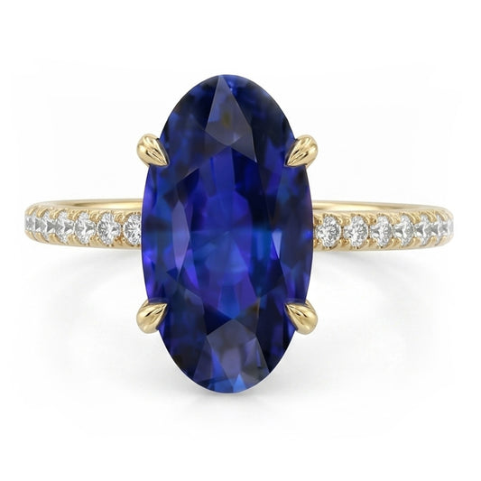 Anello solitario in oro giallo con zaffiro blu ovale con accenti 4 carati