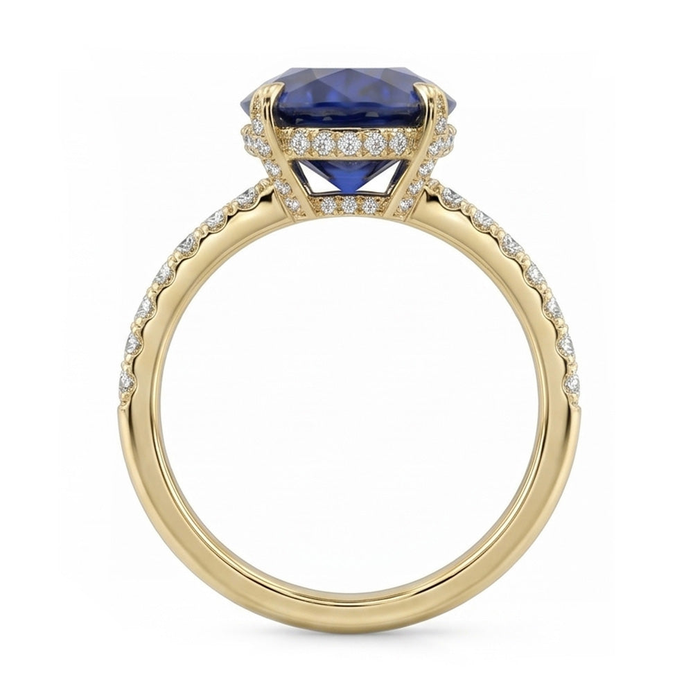 Anello solitario in oro giallo con zaffiro blu ovale con accenti 4 carati