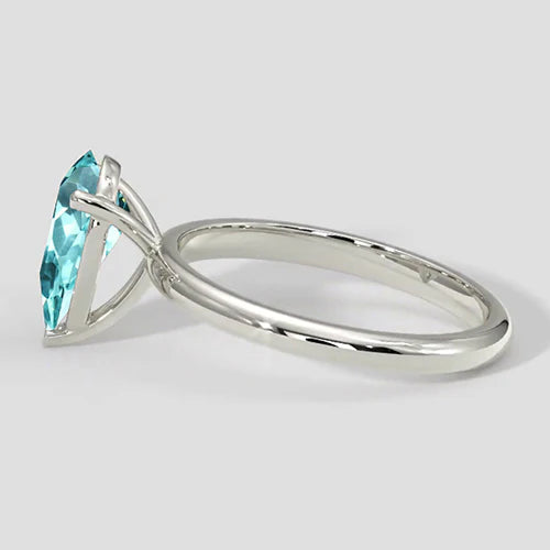 Anello Paraiba con montatura a pera e solitario