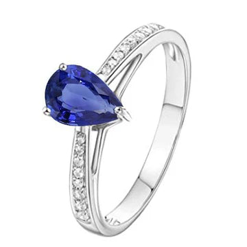 Anello Solitario con accenti di zaffiro blu 2,50 carati e pavé di diamanti in oro bianco 14K