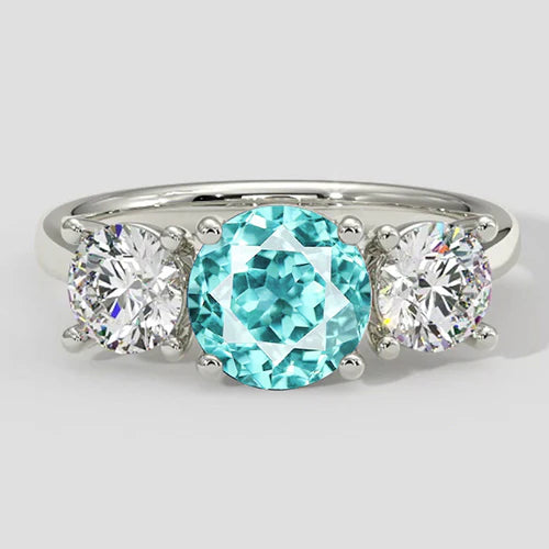 Anello a tre pietre con tormalina Paraiba e diamanti rotondi