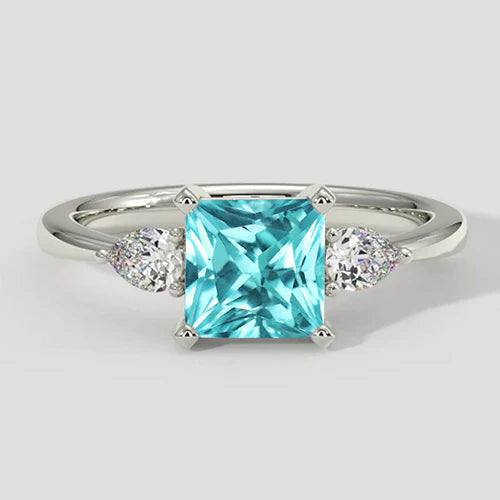 Anello di fidanzamento a cuscino con tre pietre Paraiba