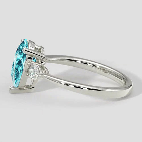 Anello laterale con pietra Paraiba a forma di pera