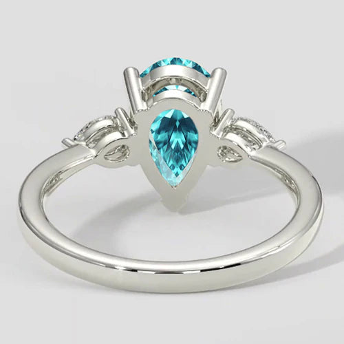 Anello laterale con pietra Paraiba a forma di pera