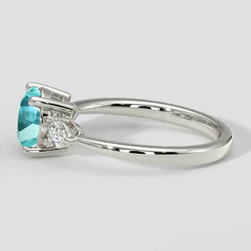 Anello rotondo con tormalina Paraiba e tre pietre
