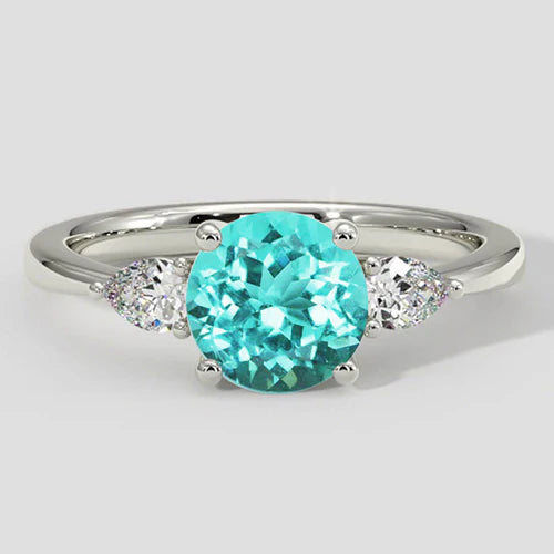 Anello rotondo con tormalina Paraiba e tre pietre